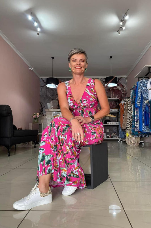pink maxi dress with Colour splash print paird with white leather sneakers
