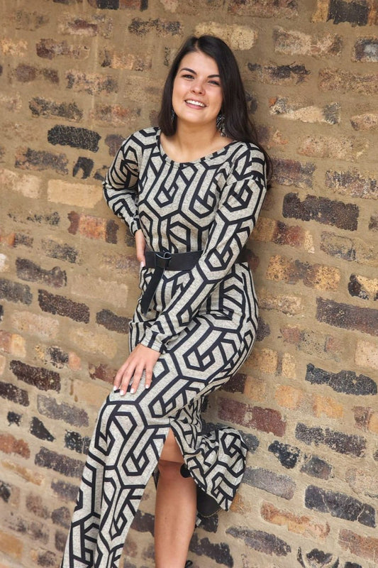 long sleeved cashmere dress with round neckline and modern maze print styled with a black belt