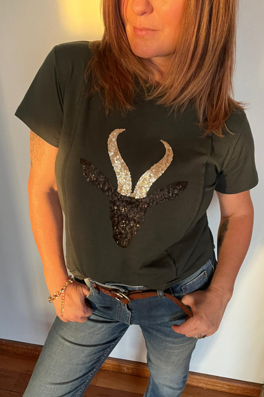 woman wearing green tshirt with springbok design 
