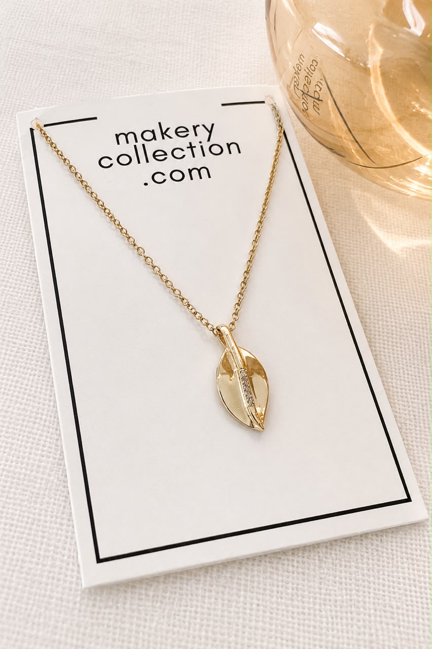 Gold Necklace With Sparkling Leaf Charm